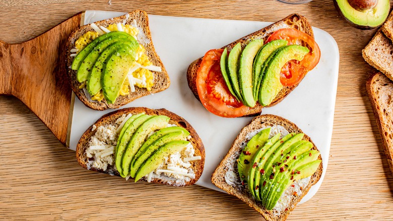 sliced avocado open faced sandwich