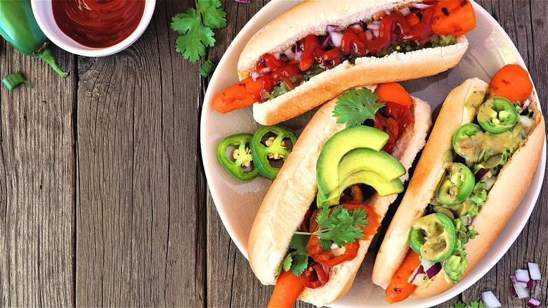 Carrot hot dogs with colorful toppings 