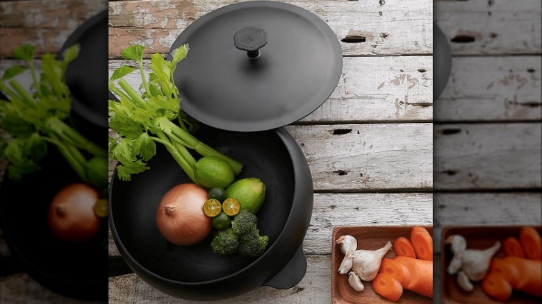 taku ironware boomerang wok with vegetables