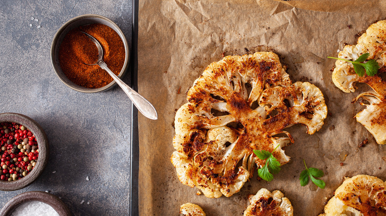 cauliflower steaks on tray, spices