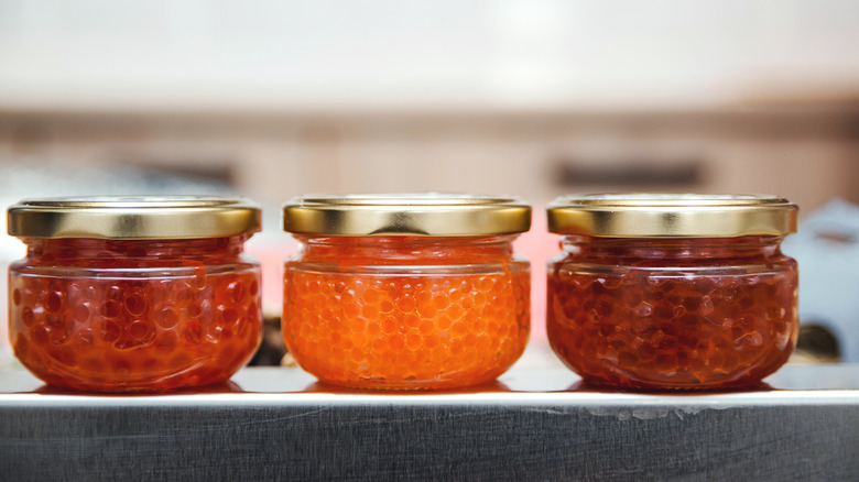 Different types of caviar in jars