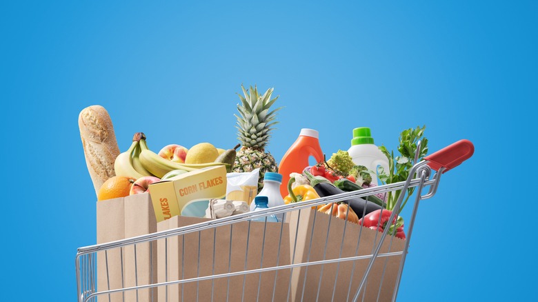 Grocery cart filled with various ingredients 