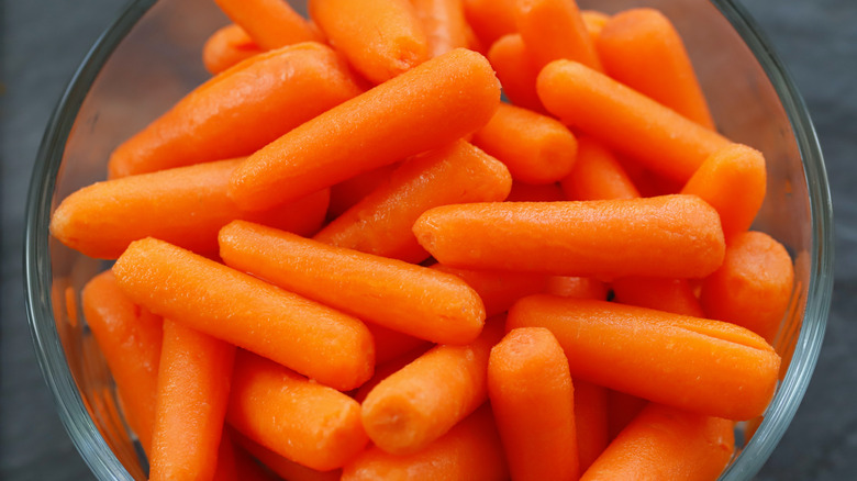 Close-up bowl of baby carrots