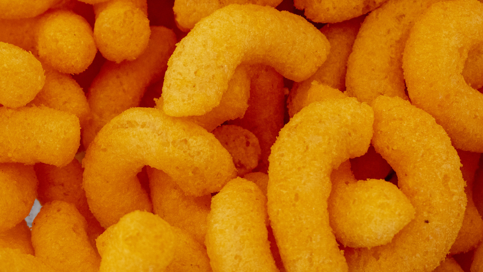 https://www.thedailymeal.com/img/gallery/cheese-puffs-might-be-the-happiest-of-accidents-in-the-snack-food-world/l-intro-1682523417.jpg