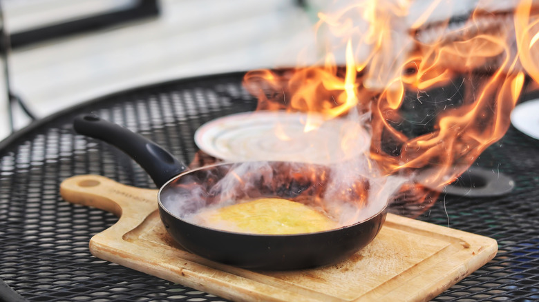 Flaming Saganaki on wooden board