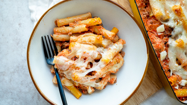 cheesy baked ziti in dish 