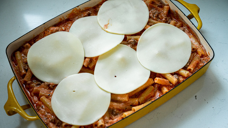 cheesy baked ziti in dish 