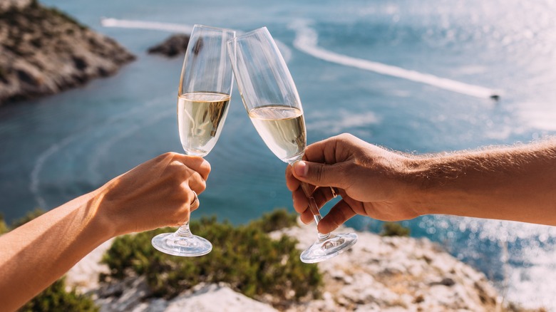 Hands holding two glasses of champagne