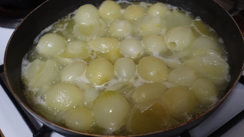 pearl onions cooking in a pan