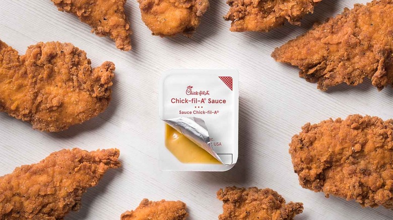 spicy strips surrounding a packet of Chick-fil-A sauce