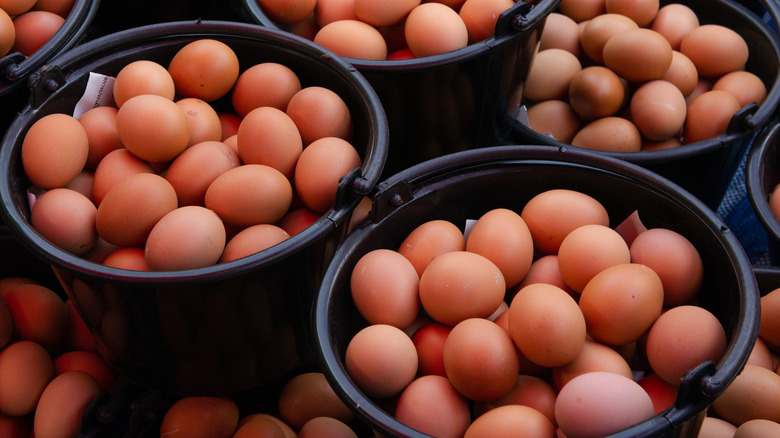 large baskets of brown eggs