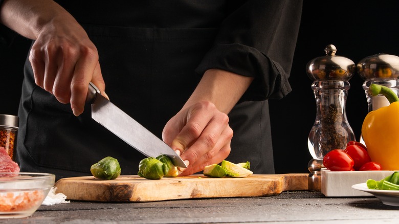 Chef chopping Brussels sprouts