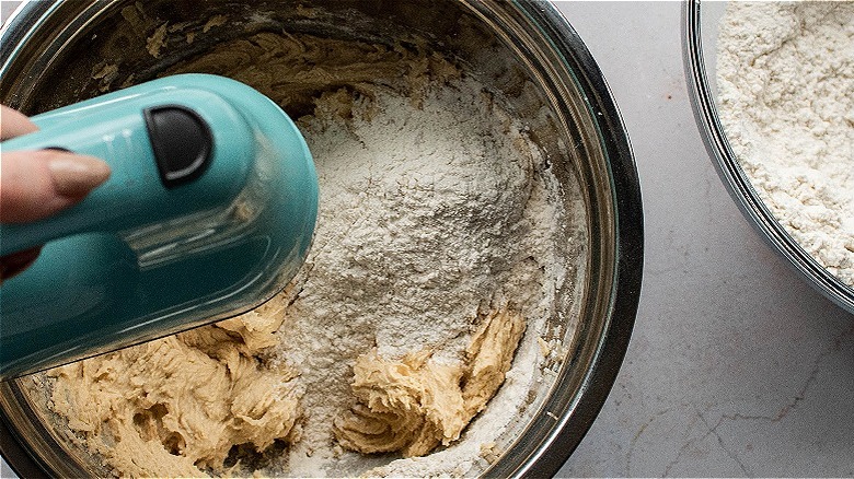 mixing flour into batter
