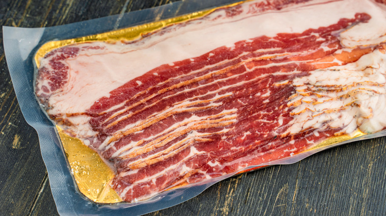 pack of uncooked bacon slices