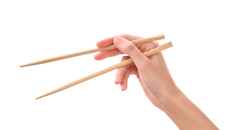 Person properly holding chopsticks