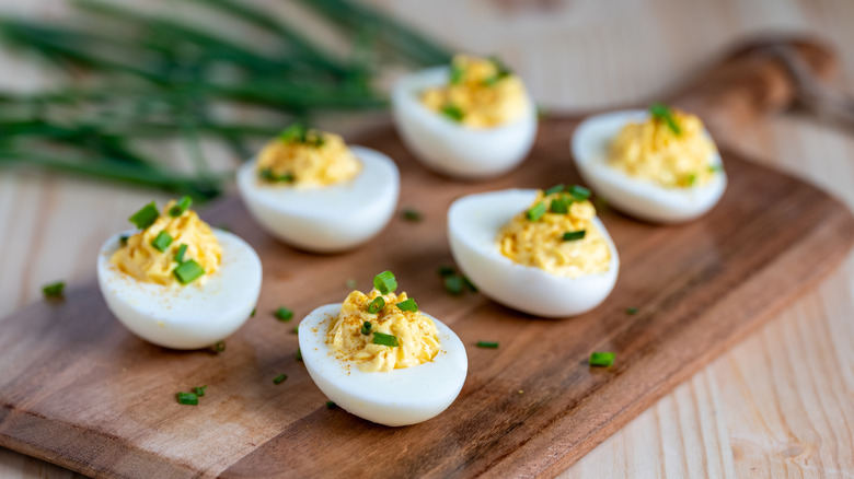 Deviled eggs on a wood cutting board