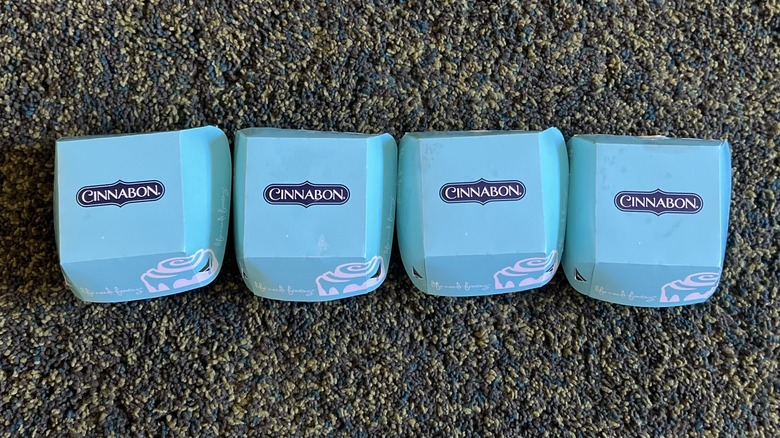 four Cinnabon boxes