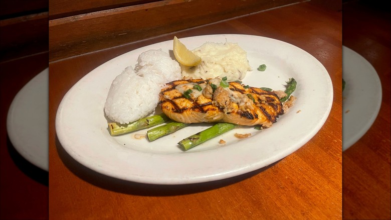 Grilled salmon atop asparagus