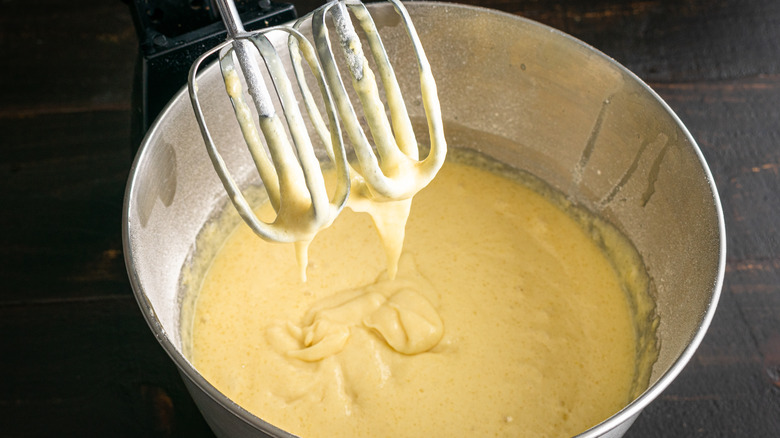 Bowl with cake batter and mixer