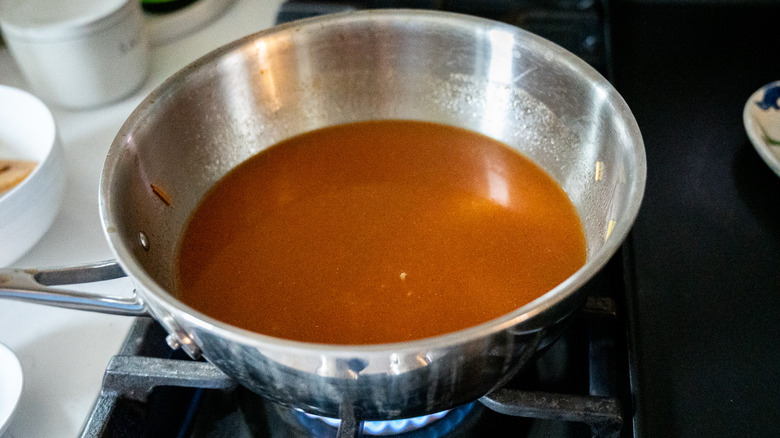 tomato broth noodles in saucepan