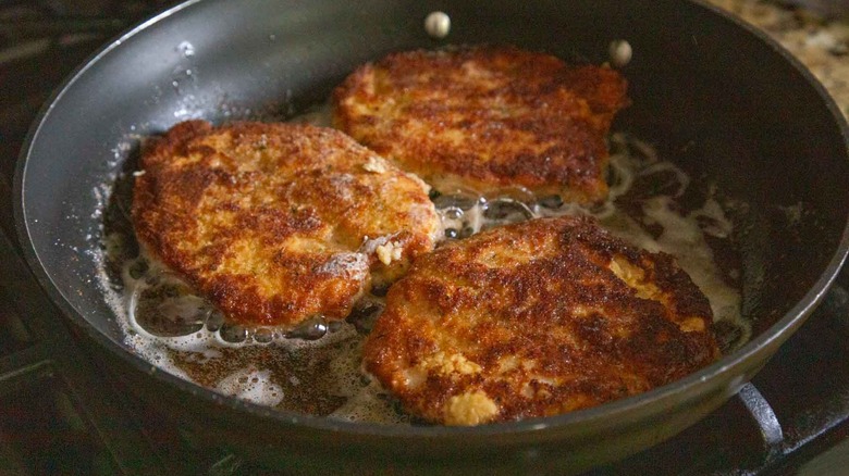 fried pork chops in a pan