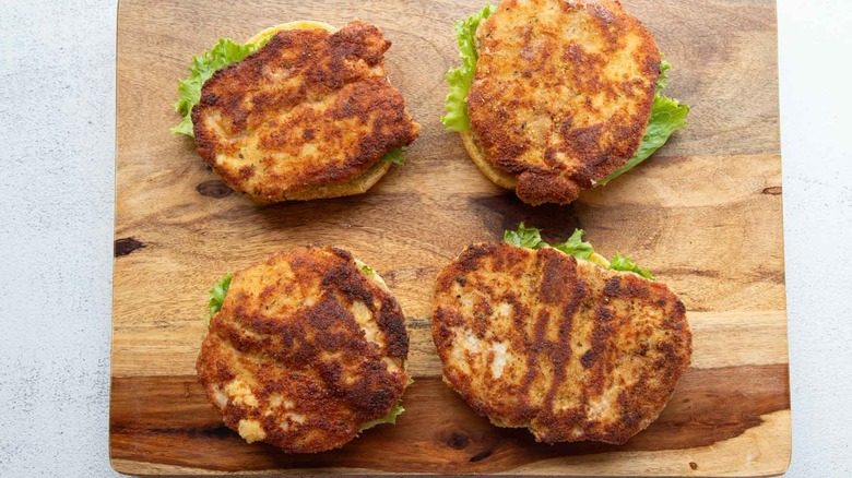 pork chops and lettuce on buns