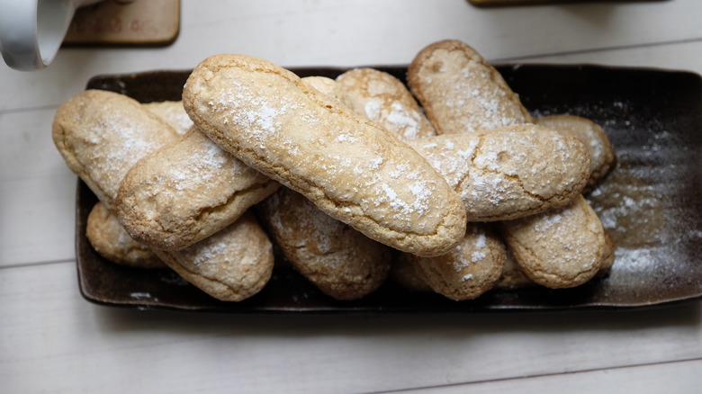 ladyfingers on black plate