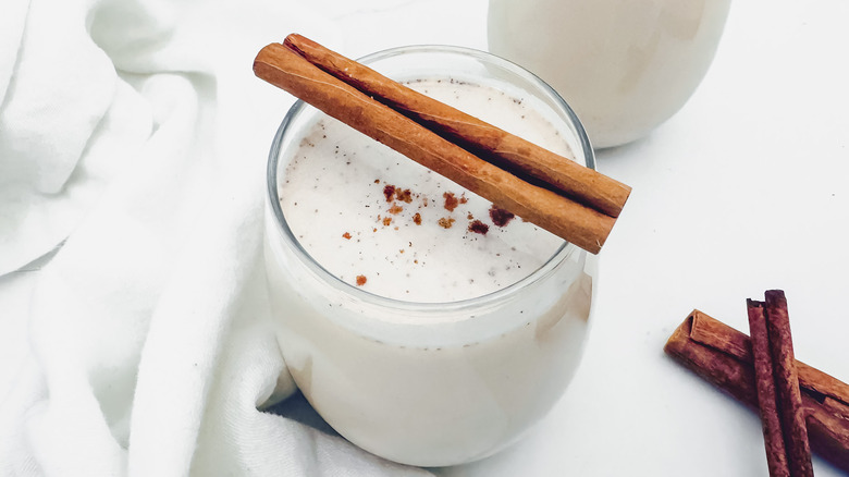 horchata glass with cinnamon stick garnish