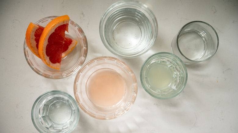 various cocktail ingredients in glasses