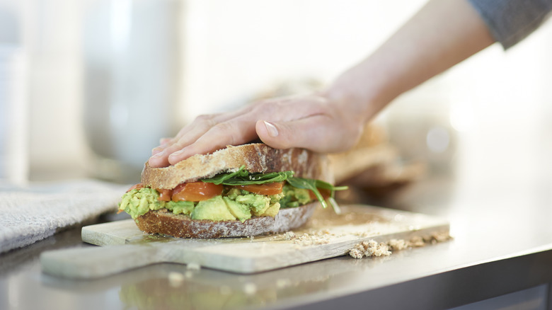 person making sandwich