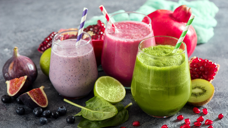 Three brightly colored smoothies