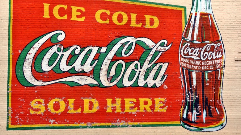 coca cola ad on brick wall