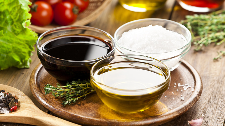 salt, oil, and vinegar in bowls