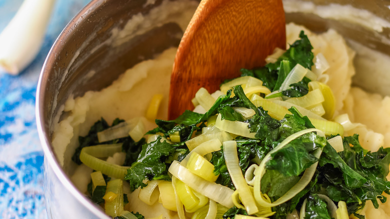 stirring a pot of colcannon