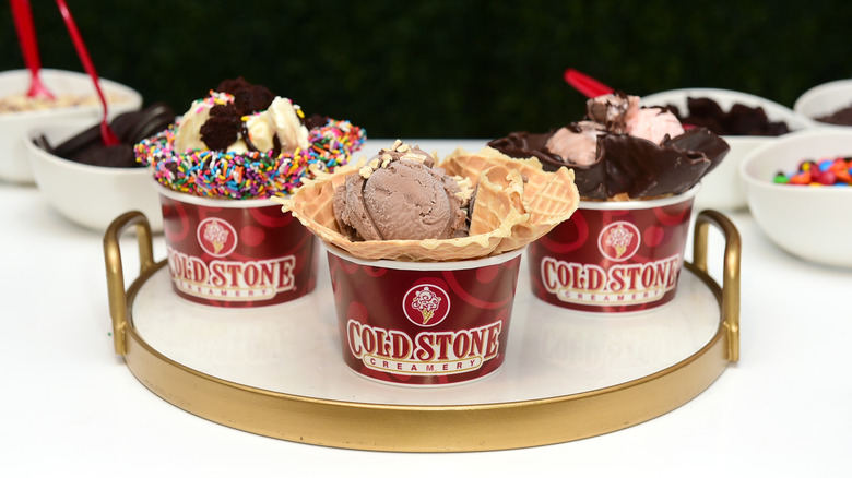 cups of cold stone creamery ice cream and toppings