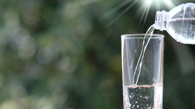 Pouring water into glass