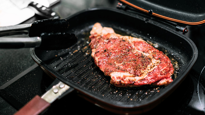 Searing a steak in a skillet