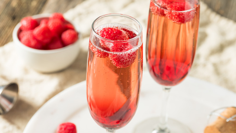 Kir royal garnished with rasberry