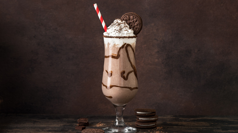 Glass filled with frozen mudslide topped with whipped cream