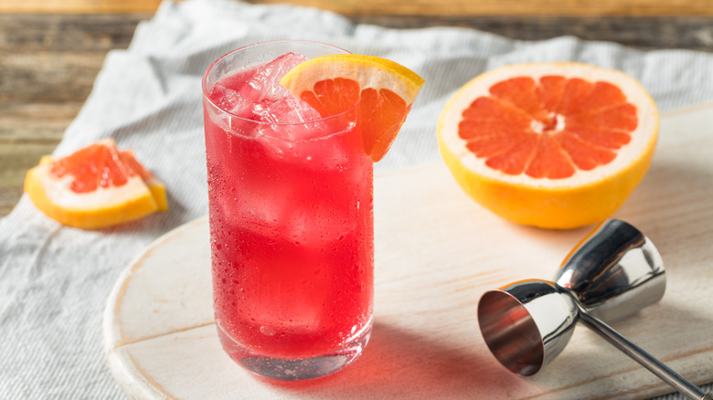 pink cocktail with sliced grapefruit