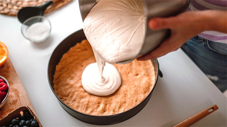 Cheesecake batter poured into crust 