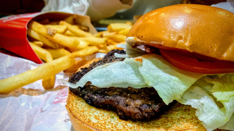 top of burger removed from bun to show square patty