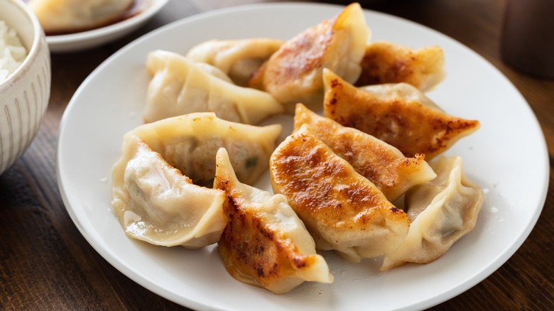 Fried dumplings on white plate