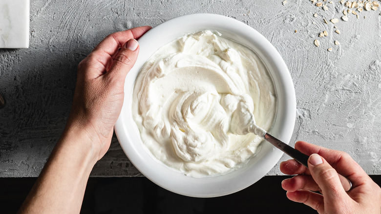 person mixing whipped cream