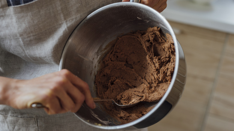 mixing cookie dough with spoon