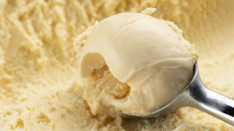 scooping vanilla ice cream