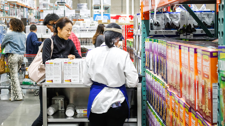 Customer sampling food while shopping