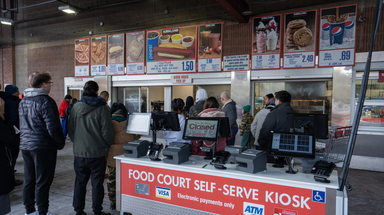 Customers in line at a Costco food court