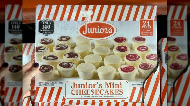 Hand holding Junior's mini cheesecakes