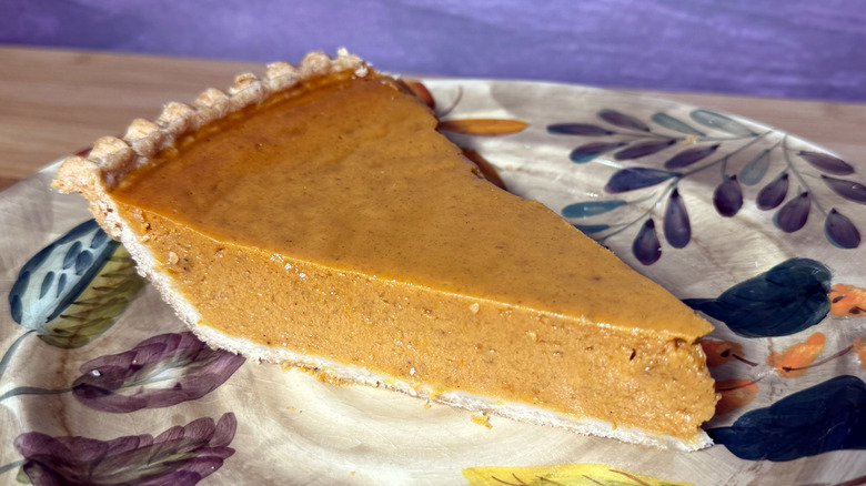 Slice of pumpkin pie on plate